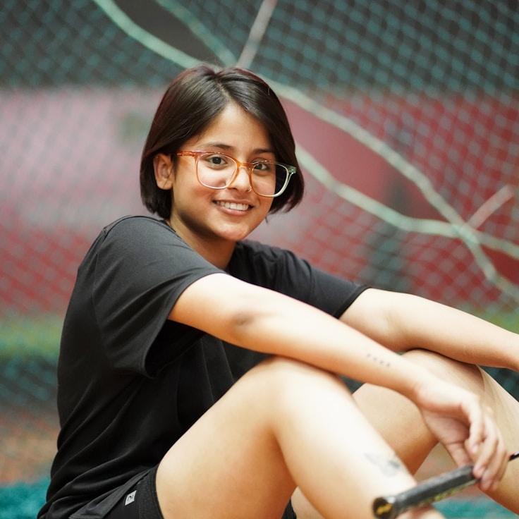 Kaveri Mehta, Lead Design Curator at StudioHarborPatch, reviewing corporate floral arrangements